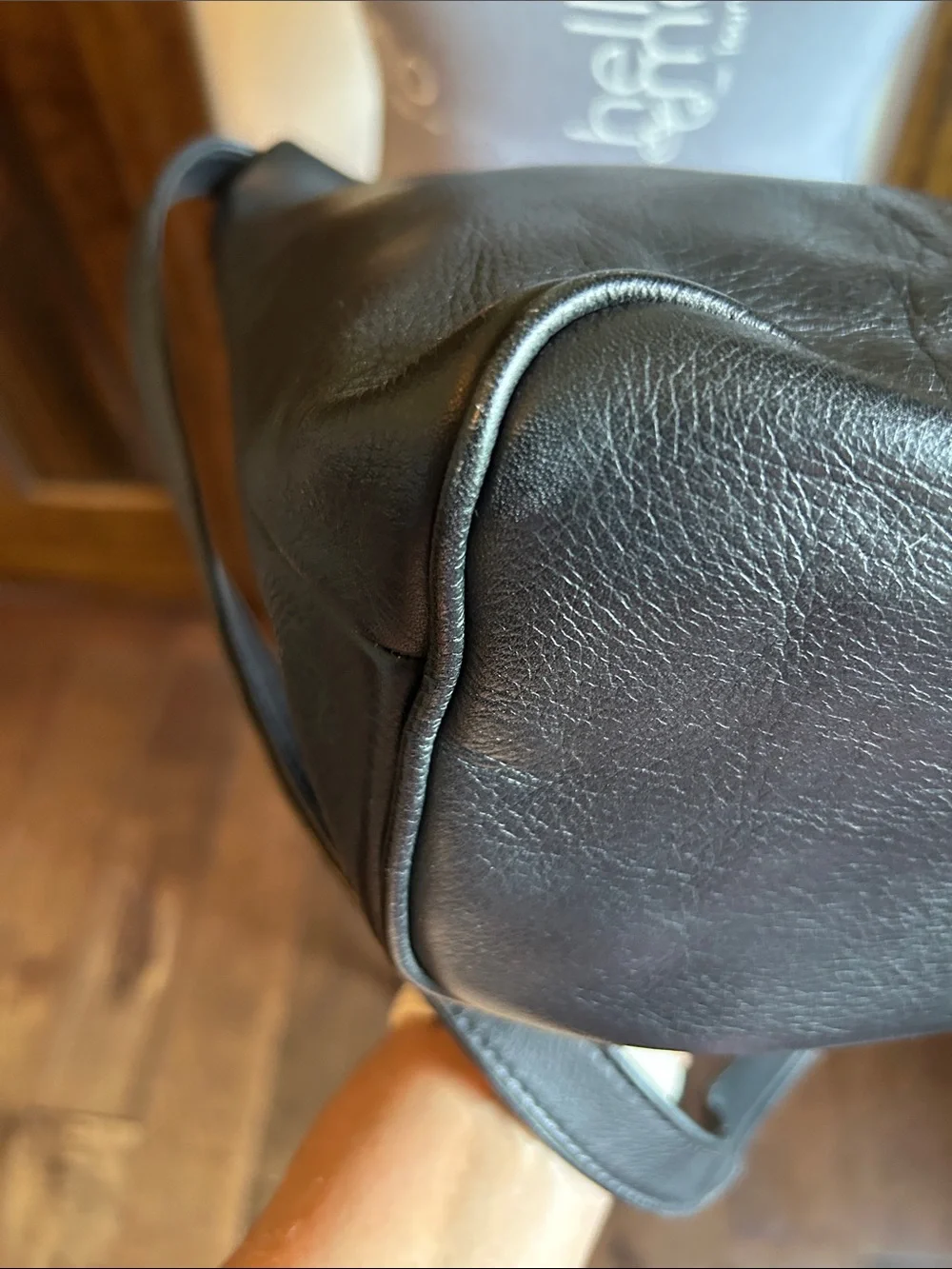 Wilsons Leather Black Pebbled Leather Crossbody Bag has tarnish on buckle - Picture 10 of 14